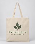 Illustrative business mockup. Natural canvas tote printed with Evergreen Landscapes logo