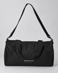 Illustrative business mockup. Black duffel bag printed with white Northline Build Co. logo
