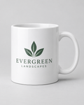 Illustrative business mockup. White ceramic mug printed with Evergreen Landscapes branding