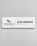 Illustrative business mockup. White Evergreen Landscapes staff badge for Alex Morgan
