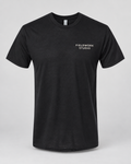 Illustrative business mockup. Next Level 6010 Soft triblend T-shirt with a small professional business logo on a neutral studio background