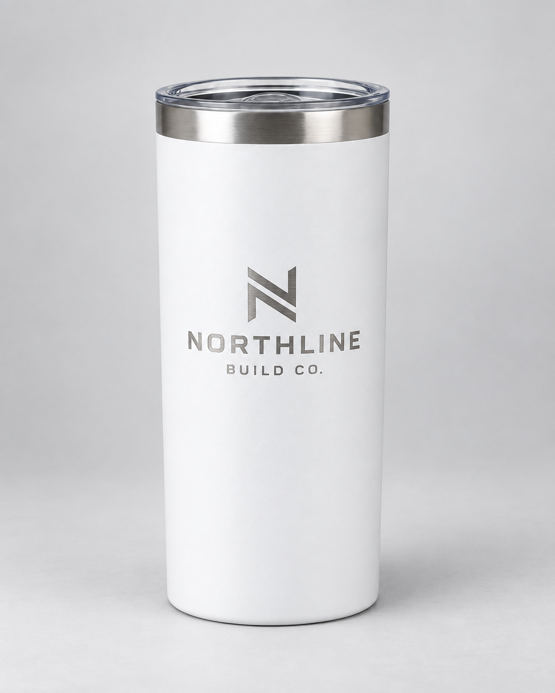Illustrative business mockup. White tumbler with single-tone Northline Build Co. engraving