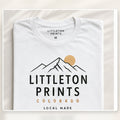 Custom T-shirt with sample Littleton artwork on a bright studio background for Littleton customers sample image
