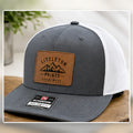 Laser patch trucker hat with sample local artwork on a bright studio background sample image