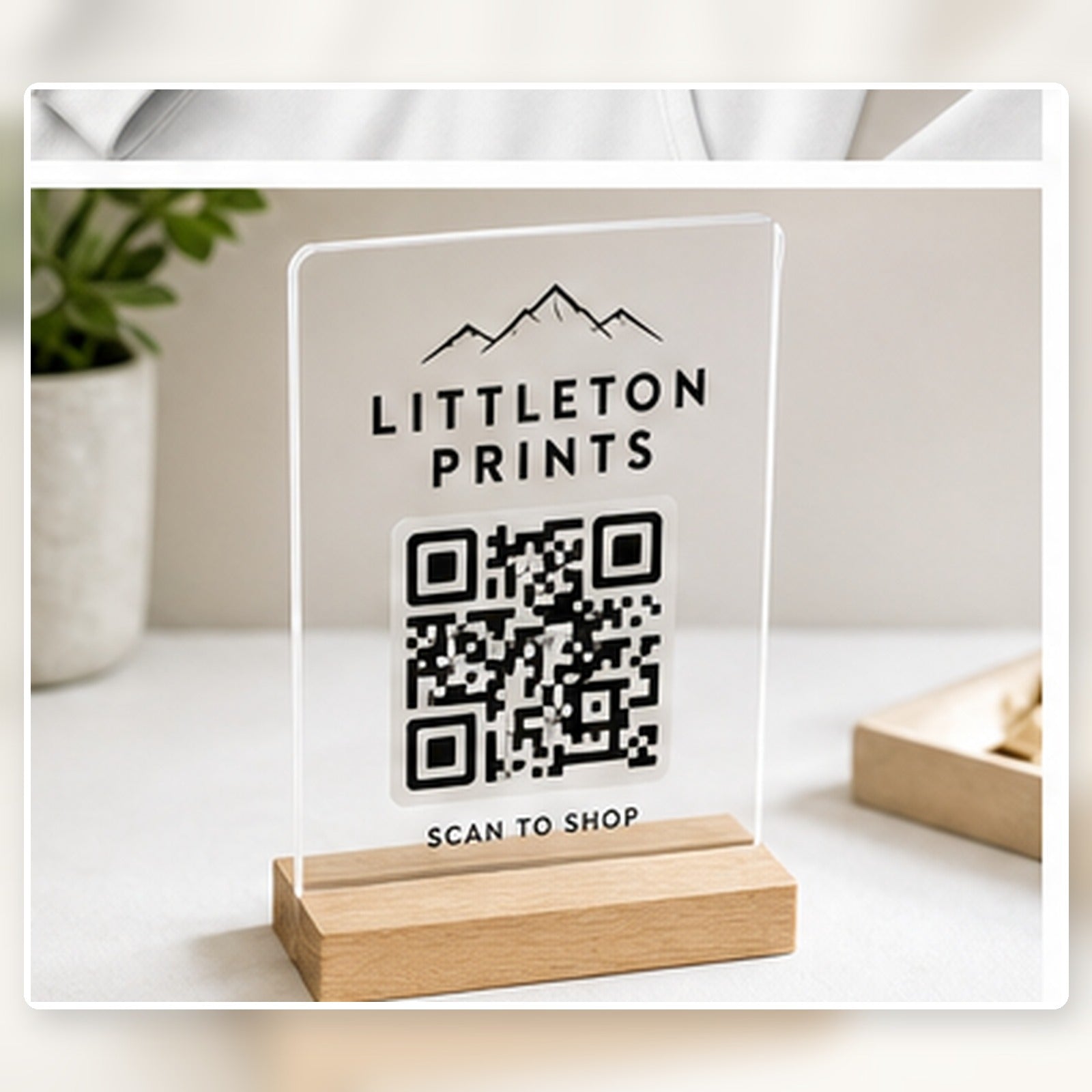 UV printed acrylic QR sign with sample local artwork on a bright studio background sample image
